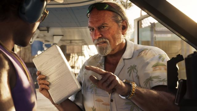 Brian holding a package while pointing at a another man in a plane.