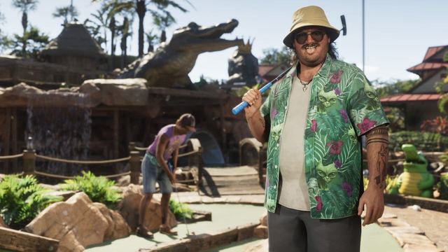Cal and another man playing mini golf at a course decorated with fake alligators.