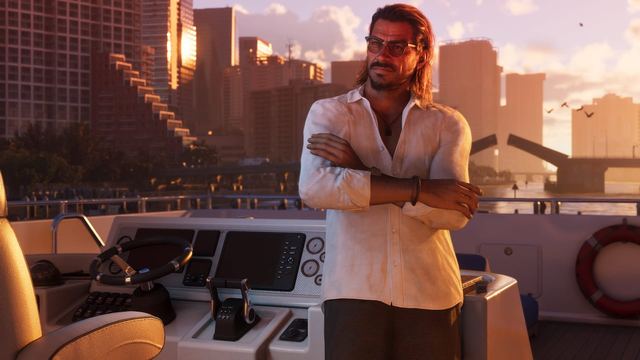 Raul crossing his arms while on a boat near the throttle.
